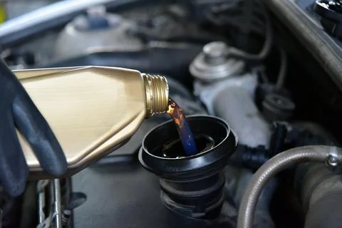 Adding Oil to a Car Stock Photos
