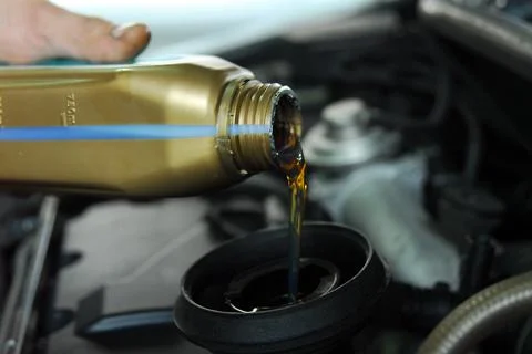 Adding Oil to a Car Stock Photos