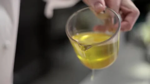 Adding oil to the dough Stock Footage 307340031