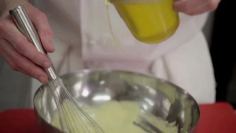 Adding oil into the dough mix Stock Footage 307340028