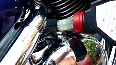 Adding oil to the motorcycle Stock Footage 78629886