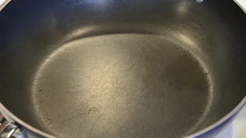 Adding Oil to the Wok Stock Footage 136059184