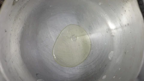 Adding Olive Oil on Hot Pan Stock Footage 129327351