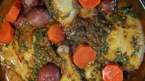 Adding Olives To Tajine Видео 82983826