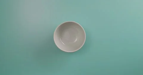 Adding onion to a bowl Stock-Footage 132194436