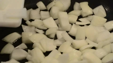 Adding Onions to the Wok Stock Footage 136059318