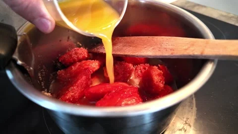 Adding orange juice to prickly pear fruit mixture Stock Footage 345081301