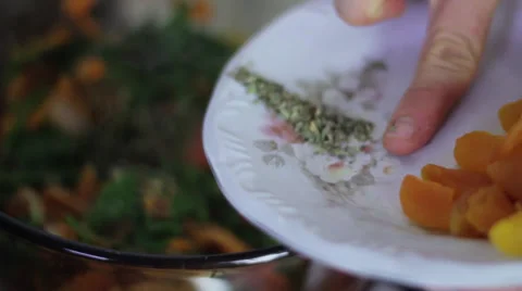 Adding oregano to pan Stock Footage 35221945