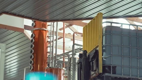 Adding pail of molasses to rum Stock Footage 74800974