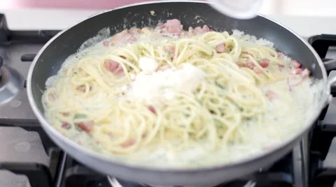 Adding Parmesan Cheese to Carbonara Stock Footage 64090128