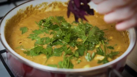 Adding Parsley and Basil to Home Style Carry Stock-Footage 113399633