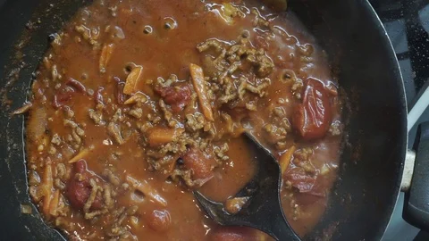 Adding pasta Stock Footage 97410800