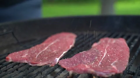 Adding pepper to bbq meat Stock Footage 158183766