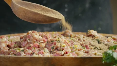 Adding pepper to forcemeat Stock Footage 138126406