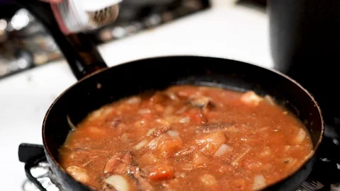 Adding pepper ingredient to sardines Stock-Footage 108219216