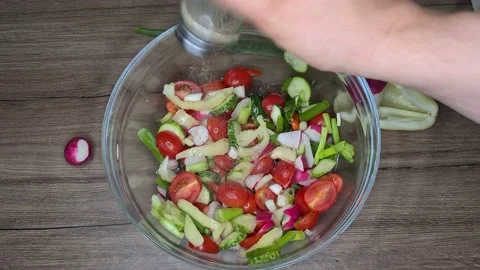 Adding Pepper Into Salad. Cooking Vegetable Salad. Stock Footage 165505420