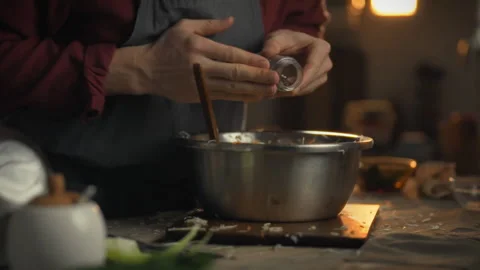 Adding peppercorns to fresh vegetables in preparation for a delicious meal Stock Footage 331315267