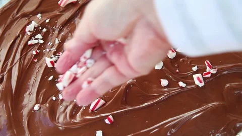 Adding peppermint bits to chocolate Stock Footage 102734202