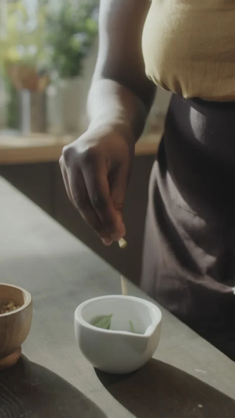 Adding Pine Nuts to Mortar Stock Footage 211644198