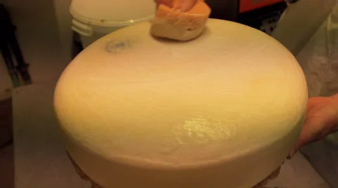 Adding a plastic coating to a cheese Stock Footage 36190241