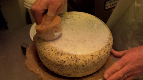 Adding a plastic coating to a cheese Stock Footage 36190322