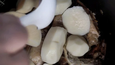 Adding potatoes Stock Footage 101967347