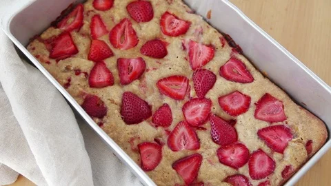 Adding powdered sugar to fresh strawberry cake Stock Footage 93768561