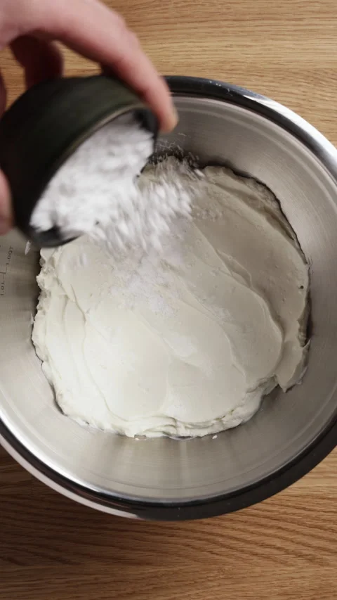 Adding Powdered Sugar To Ricotta In Bowl Vertical Top View Vídeos de archivo 334232234