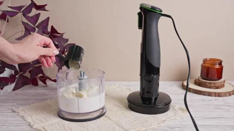 Adding protein powder to banana and milk in food processor bowl 스톡 동영상 344255713