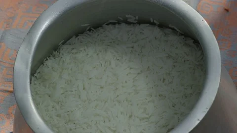 Adding pumpkin to rice. Cooking traditional turkish food pilaf Video stock 76248000