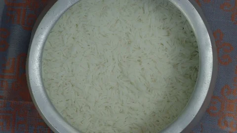 Adding pumpkin to rice. Cooking traditional turkish food pilaf Stock Footage 76251709