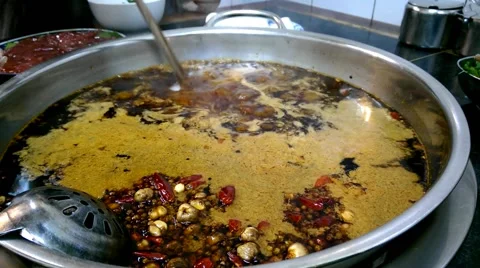 Adding quail eggs to a boiling hot pot, so called huoguo Stock Footage 44461002