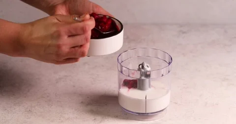 Adding raspberry in blender smoothy preparation Stock Footage 194105074