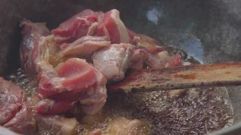 Adding RAW Pork to Boiling Hot Oil Video stock 308066278