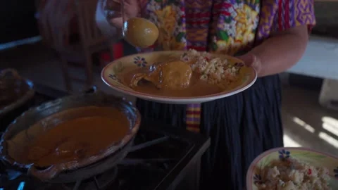 Adding Recado to Pepián Blanco Stock Footage 293176191