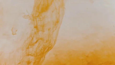 Adding red dye in the orange water Stock Footage 69178327