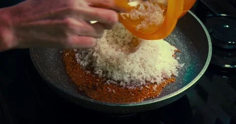 Adding rice to roasted noodles Stockbeeldmateriaal 167431553