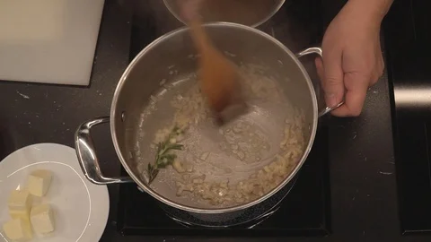 Adding rice to vegetables overhead Stock Footage 112127410