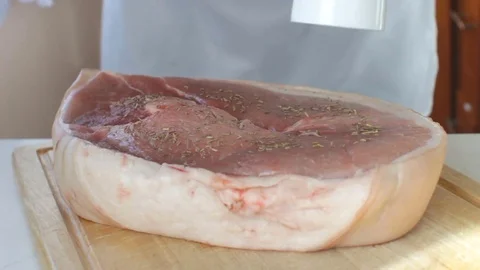 Adding Rosemary and Ground Pepper to a Huge Steak Stock Footage 83388360