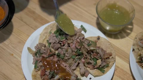 Adding Salsa To Delicious Plate Of Tacos In Mexico City Stock Footage 154647189