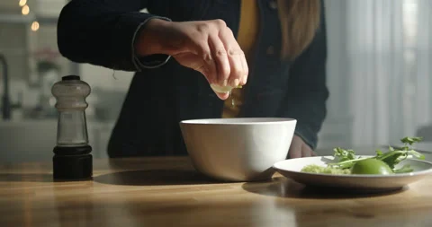Adding Salt And Lime To Sauce In Home Kitchen Stock Footage 169992488
