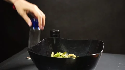 Adding salt and pepper spices Stock Footage 133647424