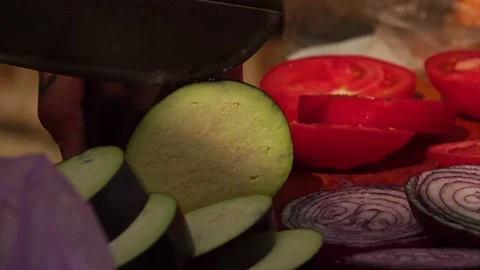 Adding salt and slicing vegetables Stock Footage 248301146