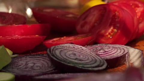 Adding salt and slicing vegetables Stock Footage 248301203