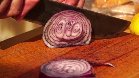 Adding salt and slicing vegetables Stock Footage 248301206