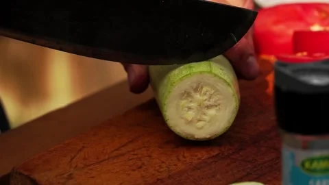 Adding salt and slicing vegetables Stock Footage 248301207
