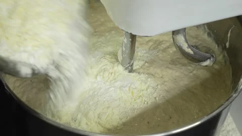 Adding salt and sugar into the mixer to keep kneading the dough 스톡 동영상 251368332