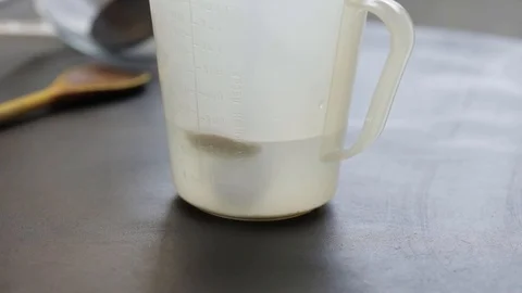 Adding salt and yeast Stock Footage 121120351