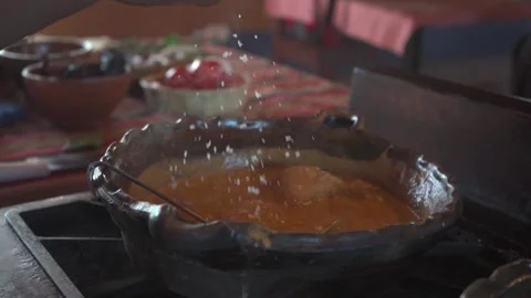 Adding Salt to Chicken Stew Stock Footage 293175477