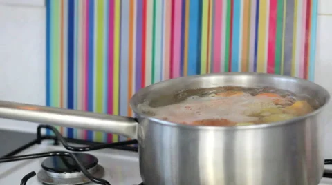 Adding salt to cooking potatoes Stock Footage 42177923